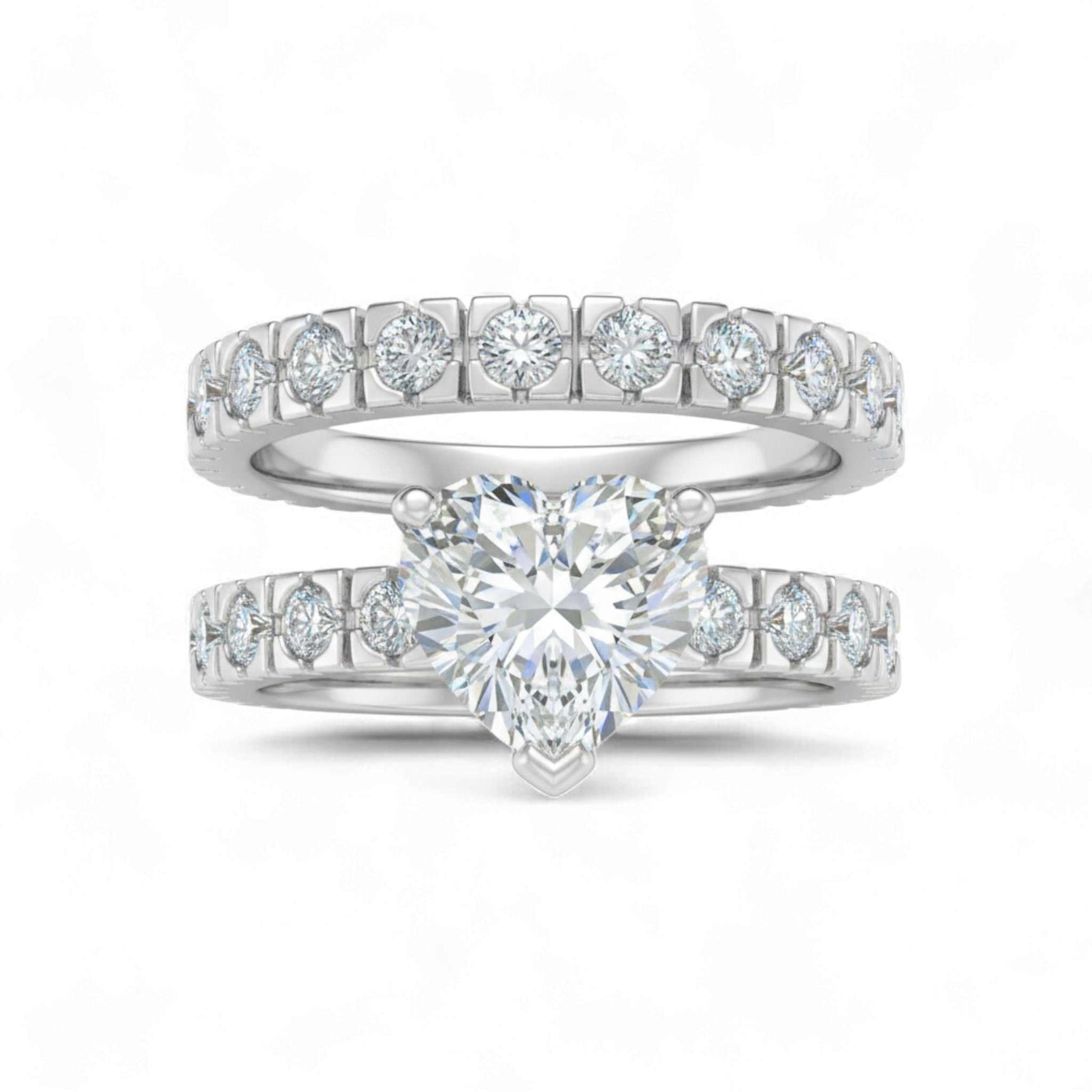 Heart shape cubic zirconia bridal set in 925 sterling silver with CZ accents on bands
