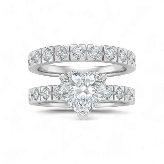 Heart shape cubic zirconia bridal set in 925 sterling silver with CZ accents on bands