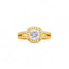 Gold ring with a diamond on a white background