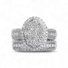 Amanda Oval Cut Natural Diamonds bridal ring set in 18KT gold with oval diamond halo and matching wedding band