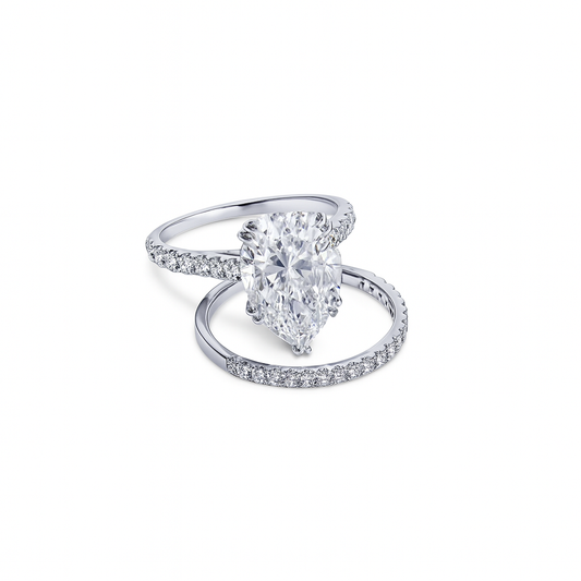 Diamond ring with pear-shaped center stone on a white background