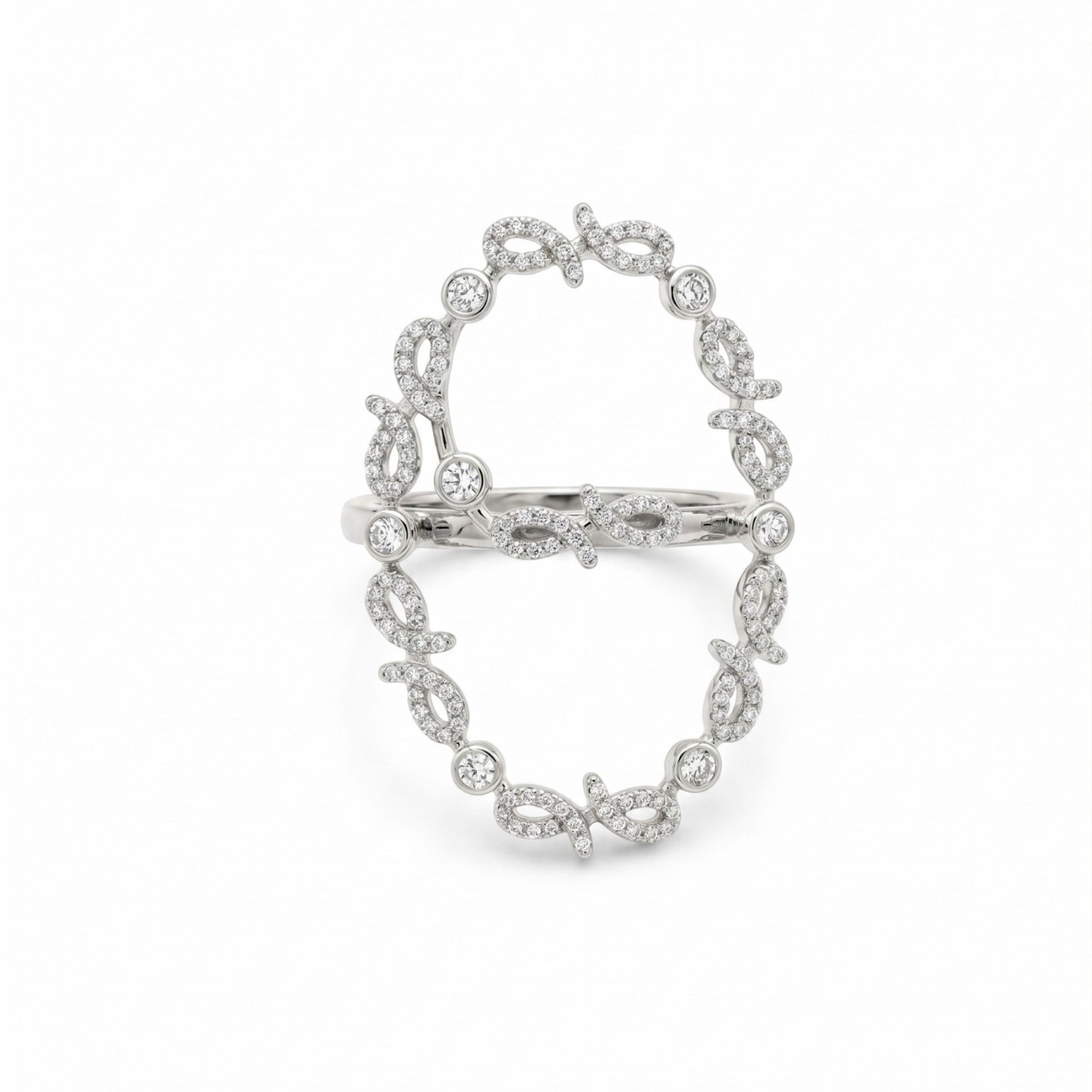 A silver-toned ring featuring an openwork oval design paved with small clear stones, displayed on a clean white background.
