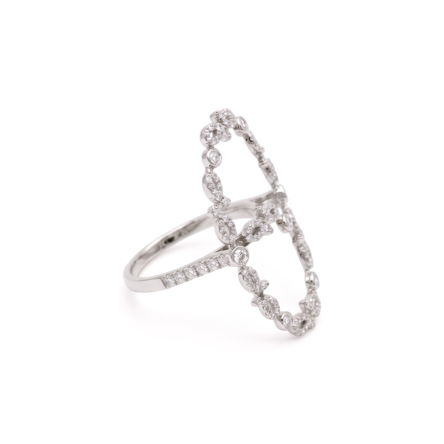 A silver-toned diamond ring with an open, butterfly-like geometric design and pavé-set stones, shown on a plain white background.