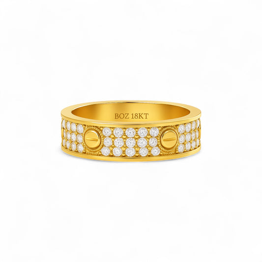 Gold ring with diamond accents on a white background