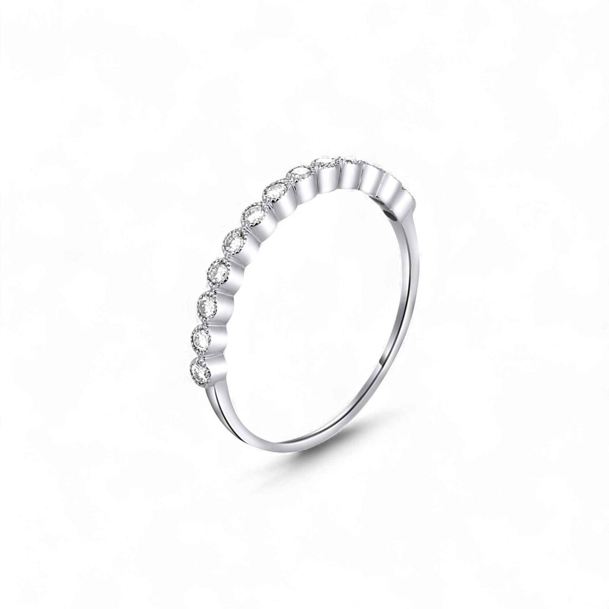 Silver ring with small diamonds on a white background
