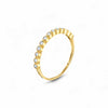 Gold ring with small diamonds on a white background