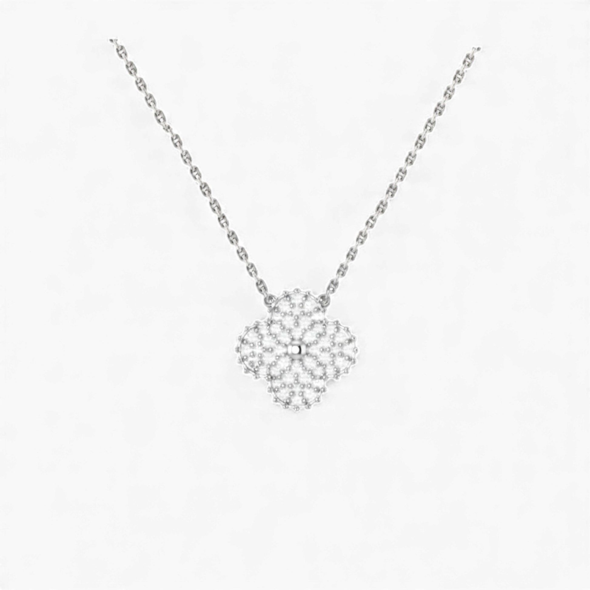 Silver necklace with a floral pendant on a white background