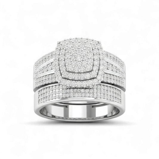 Silver ring with multiple bands and diamond accents on a white background