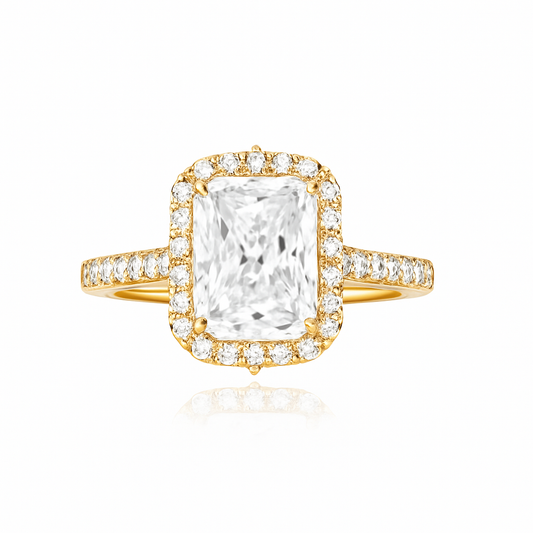 Gold ring with a large central diamond and smaller diamonds around on a white background