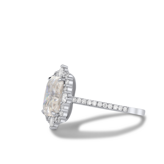 Diamond ring with a large central gemstone and smaller stones on a white background