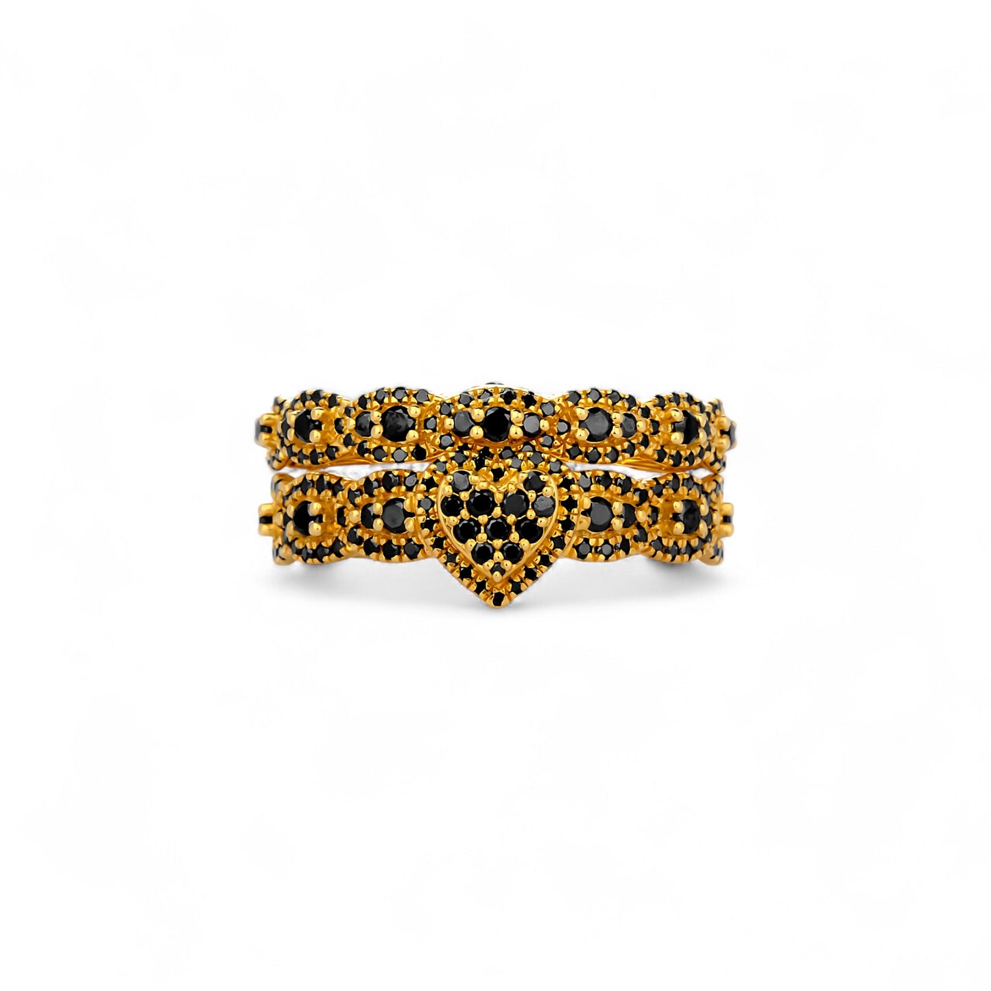 Gold and black gemstone ring on a white background