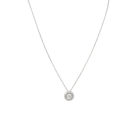 Silver necklace with a round pendant on a white background