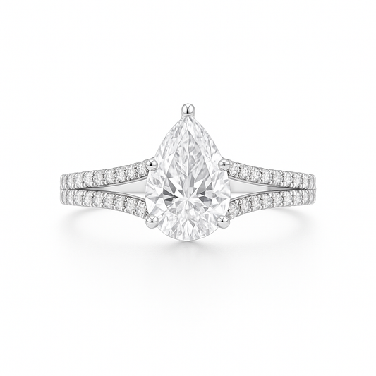 Diamond ring with pear-shaped center stone on a white background