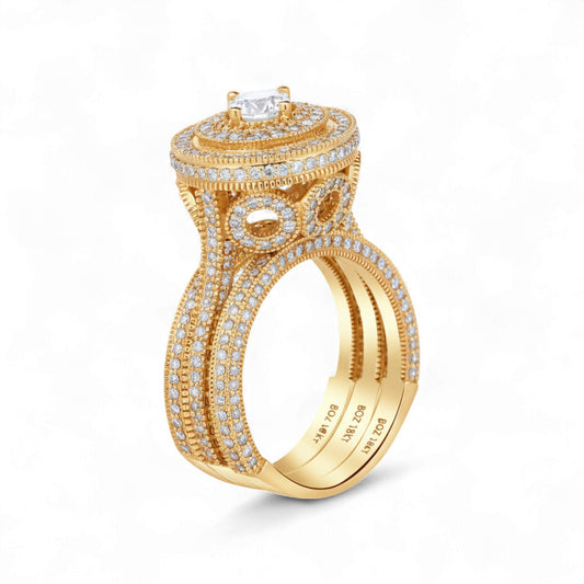 Gold ring with diamond accents on a white background