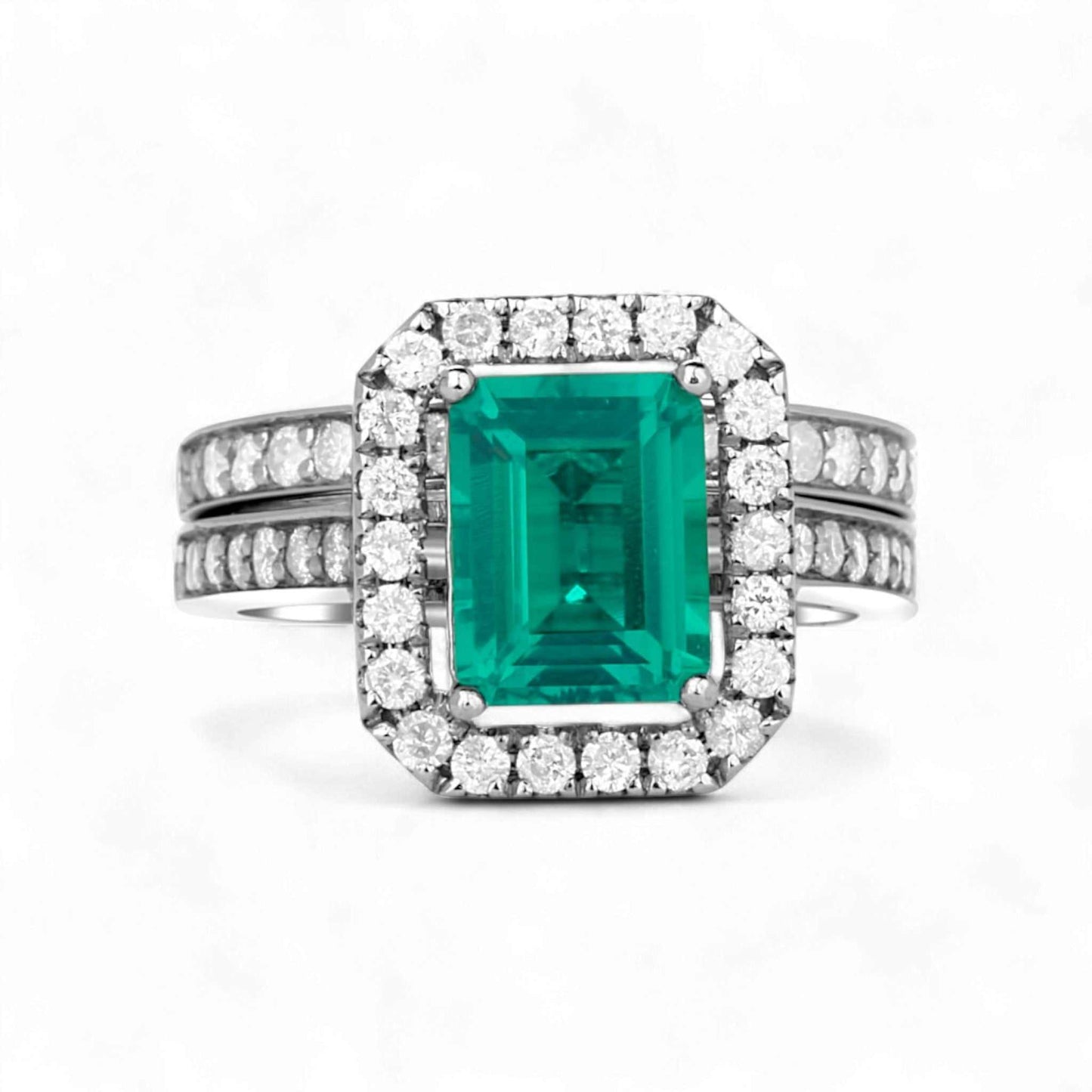Platinum bridal set featuring radiant cut green ruby center stone surrounded by natural diamond halo and side stones Ruby Love Radiant Cut