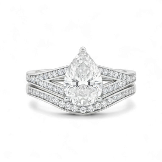 Diamond ring with a pear-shaped center stone on a white background