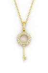 Gold key-shaped pendant necklace on a white background