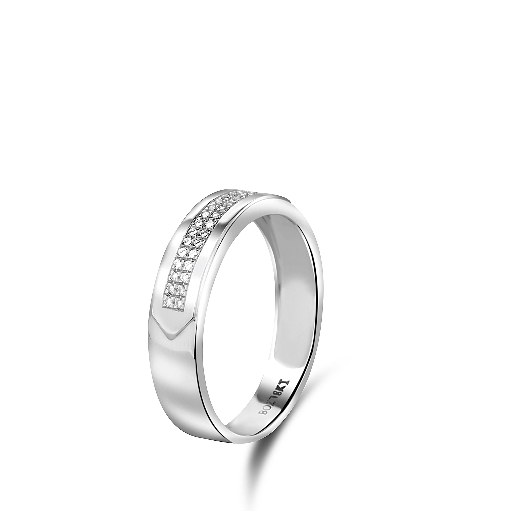 Silver ring with embedded stones on a white background