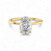 Gold ring with a large diamond on a white background