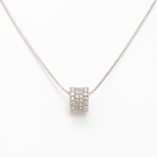 Silver necklace with a square pendant on a white background