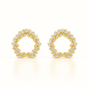 Gold earrings with diamond-like stones on a white background