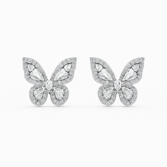 Butterfly-shaped earrings with gemstones on a white background