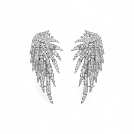 Pair of silver leaf-shaped earrings on a white background