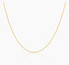 A dainty 18k gold chain necklace displayed against a white background.