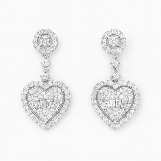 Heart-shaped diamond earrings on a white background