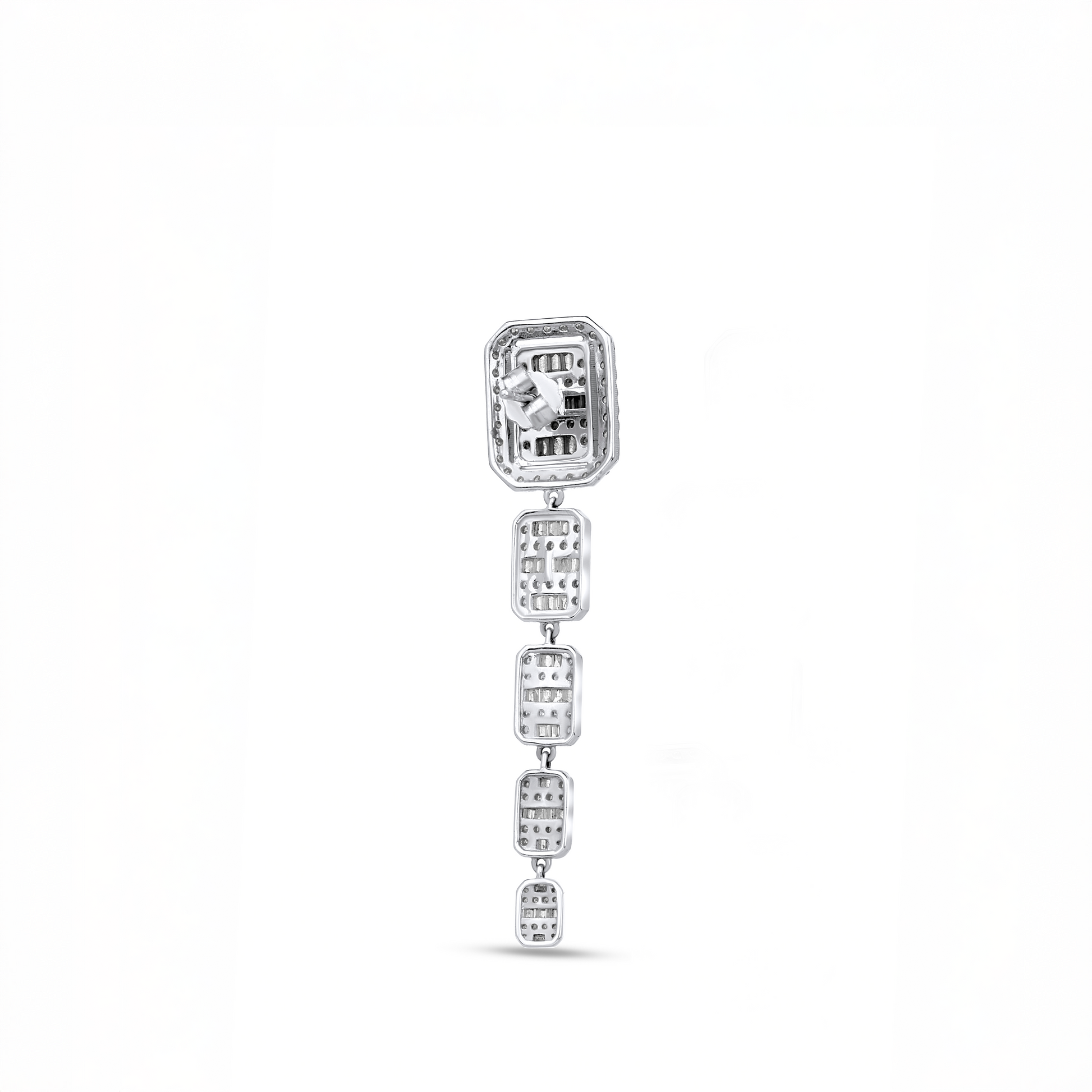Silver earring with clear gemstones on a white background
