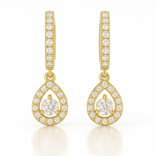 Gold teardrop earrings with clear gemstones on a white background