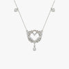 Silver necklace with a heart-shaped pendant on a white background
