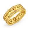 Gold ring with intricate design on a white background