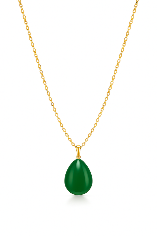 Gold necklace with a green teardrop pendant on a white background