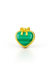 Heart-shaped green stone with gold border and bow on a white background