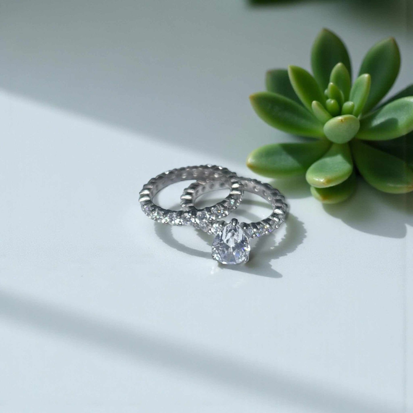 Vega Pear CZ sterling silver bridal ring set with pear-shaped cubic zirconia and pavé accents