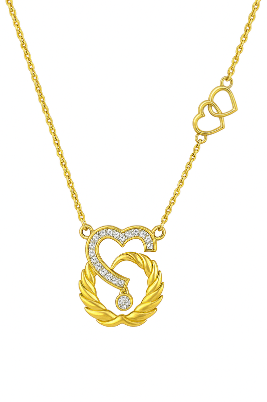 Gold necklace with a heart-shaped pendant on a white background