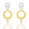 Pair of gold earrings with circular designs on a white background