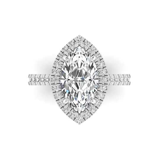 A marquise cut moissanite gemstone in a sterling silver mounting with a halo of smaller stones around it.