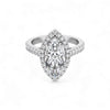 Diamond ring with a marquise-shaped center stone on a white background