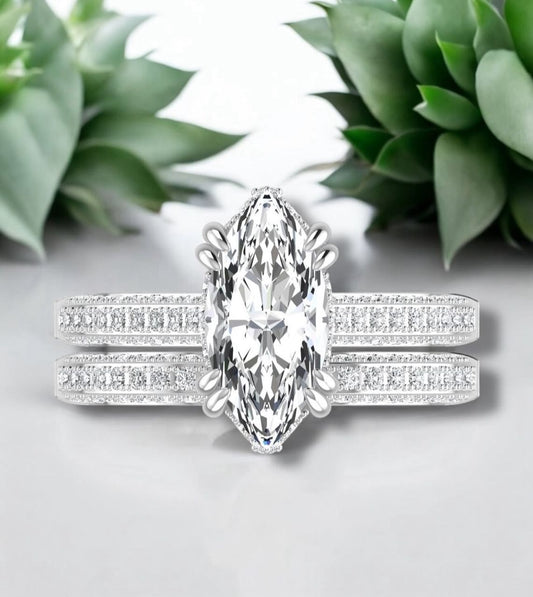 Diamond ring with a green plant in the background