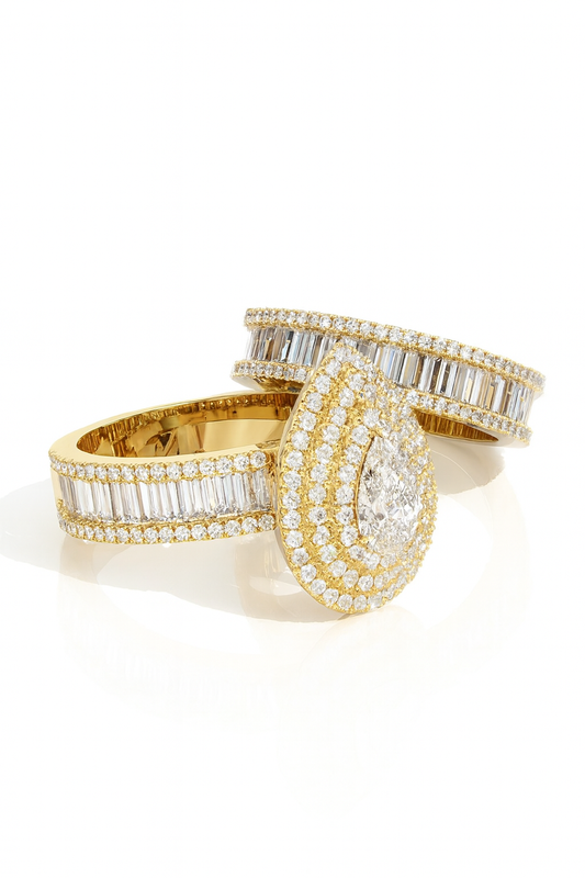 Two gold and diamond rings on a white background