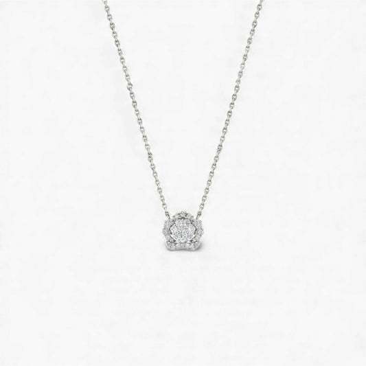 Silver necklace with a round pendant on a light gray background