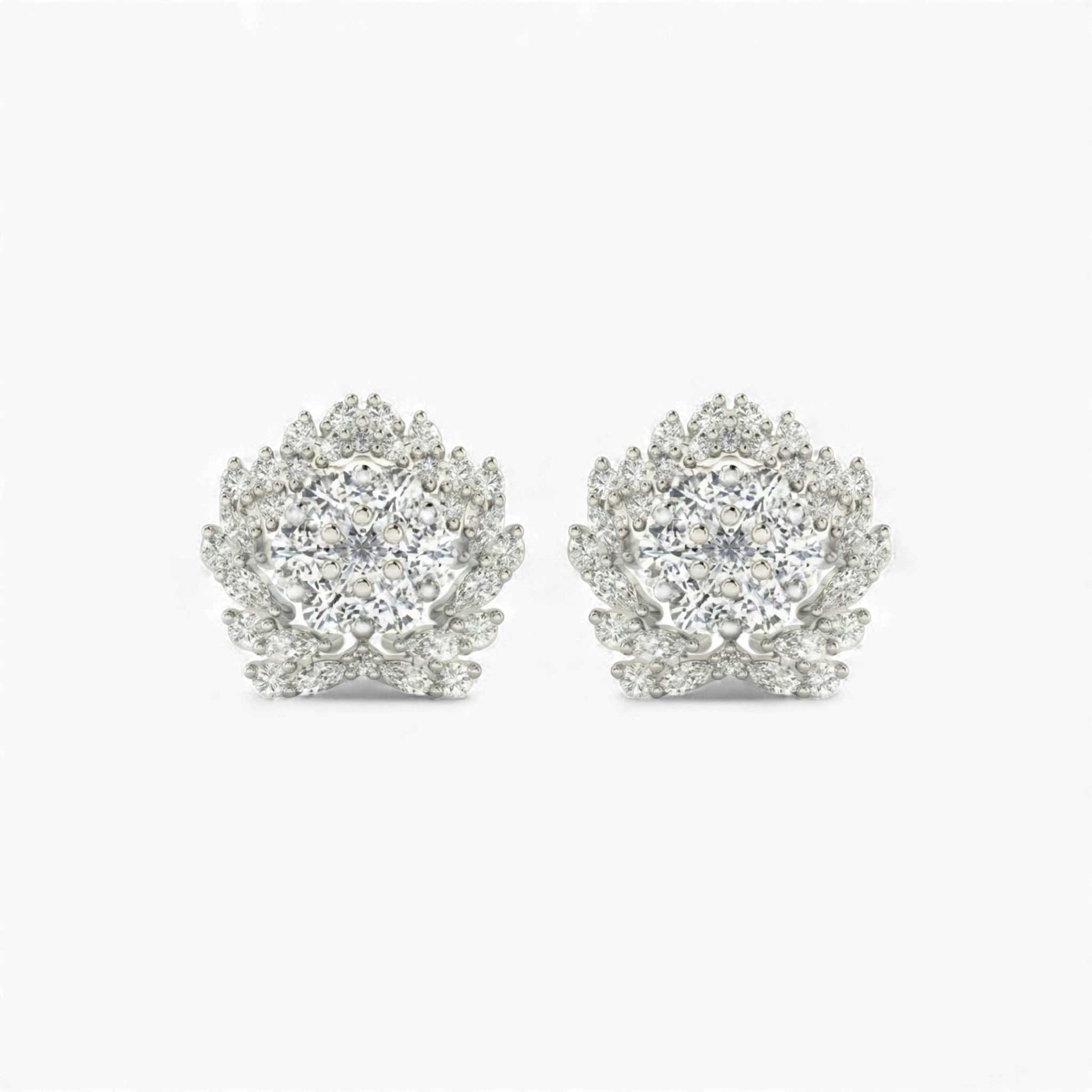 Pair of silver earrings with clear gemstones on a white background