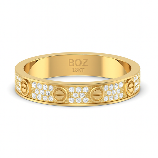 Gold ring with 'BOZ' branding and diamond accents on a white background