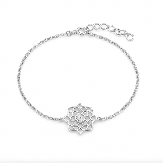 Silver bracelet with a floral design on a white background