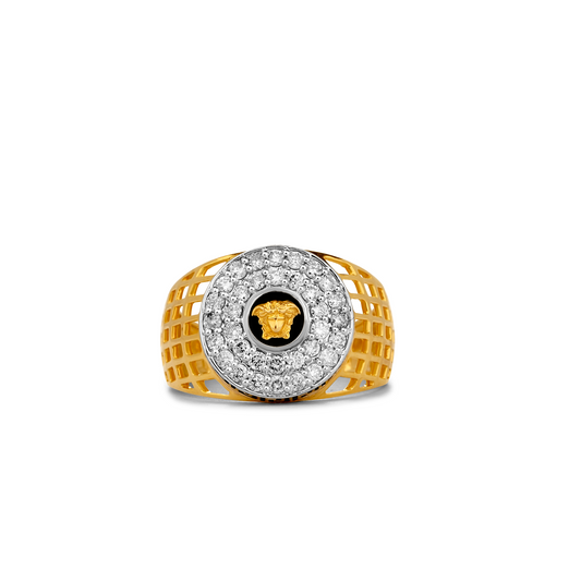 Gold and silver ring with a black center and logo on a white background