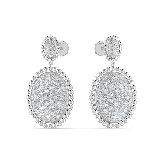 A pair of silver drop earrings with VVS1 D Moissanite stones, featuring a round design with intricate metalwork around the edge.