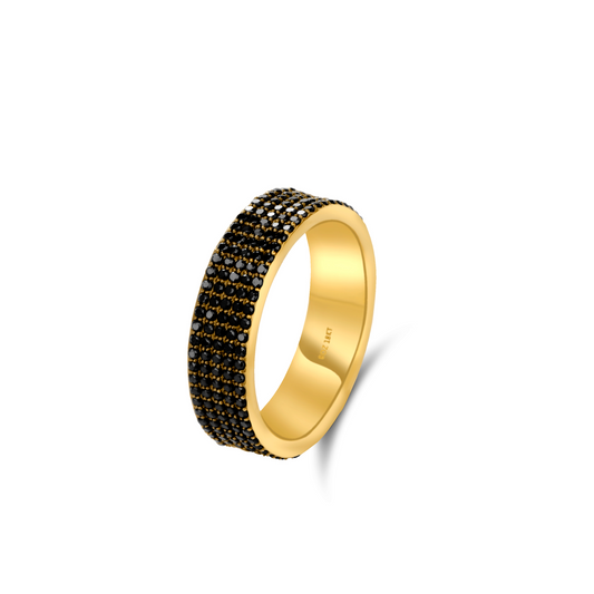 Gold ring with black gemstones on a white background