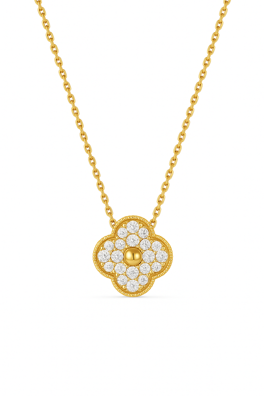 Gold necklace with a clover-shaped pendant on a white background